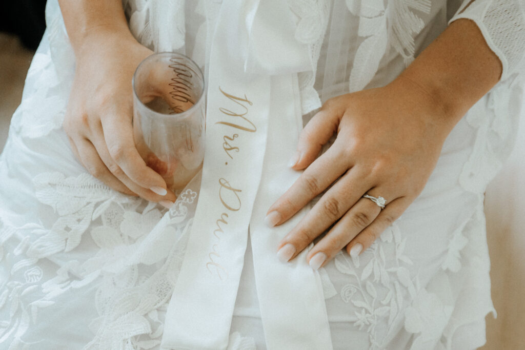 close up of bride's hands while getting ready