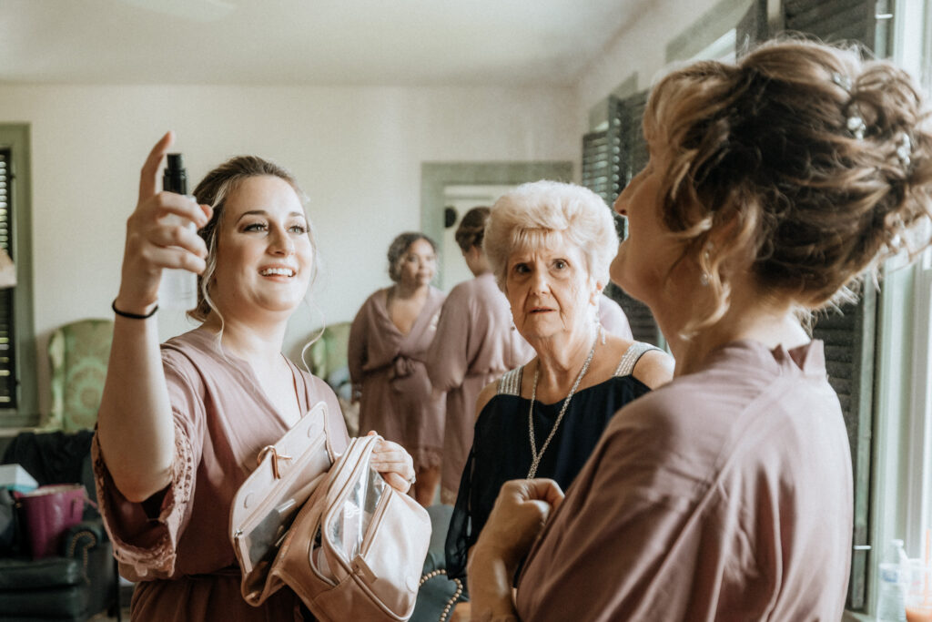 bride's grandmother and mother getting ready for valley view farm wedding