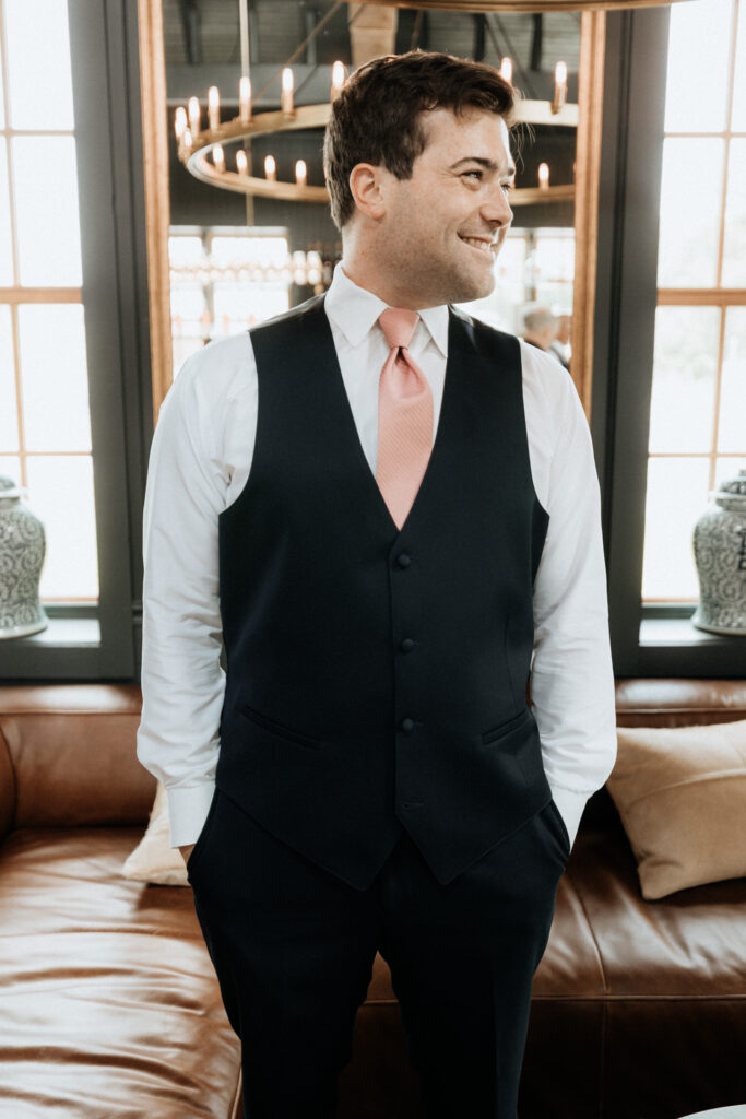 portrait of groom in cider barn at valley view farm