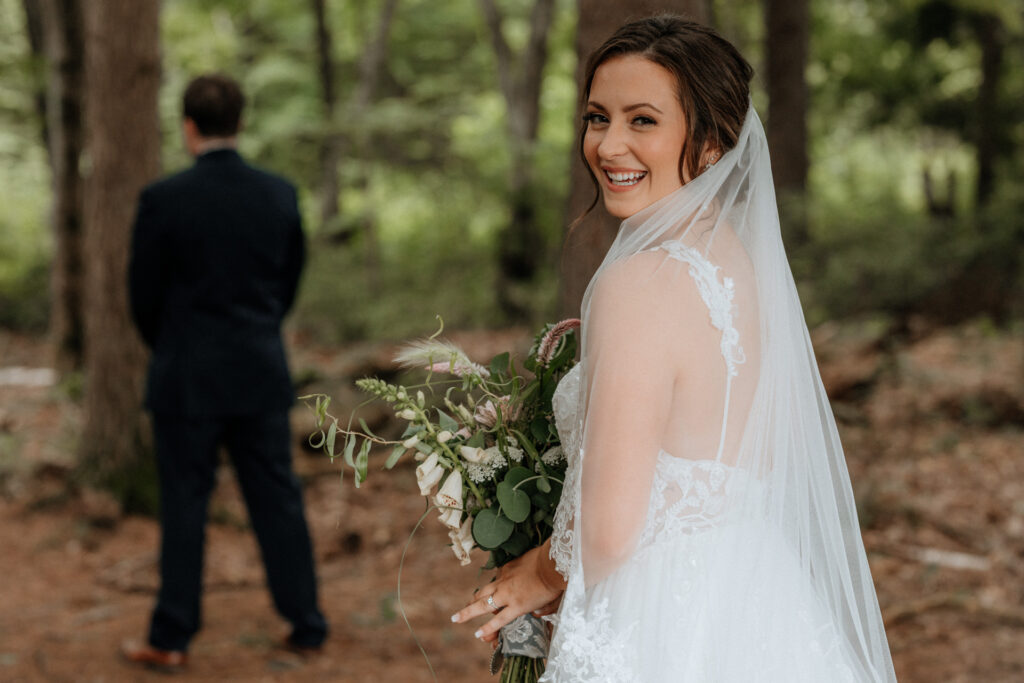 bride looking at camera before first look